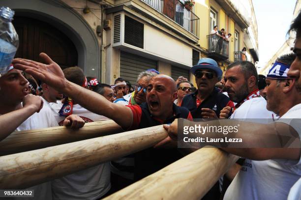 Men carry a 25-metre tall wood and papier-mache statue called 'giglio' during the annual Festa dei Gigli on June 24, 2018 in Nola, Italy. When St....