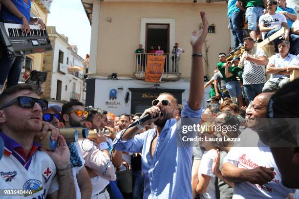 Men carry a 25-metre tall wood and papier-mache statue called 'giglio' during the annual Festa dei Gigli on June 24, 2018 in Nola, Italy. When St....