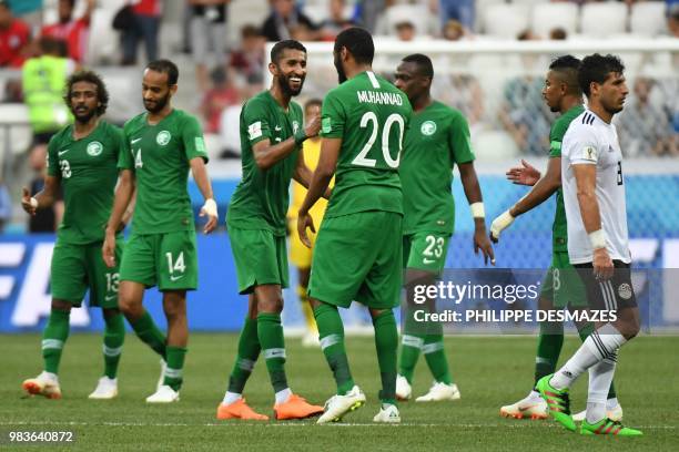 Saudi Arabia's midfielder Salman Al-Faraj celebrates with forward Mohannad Assiri after forward Salem Al-Dawsari scored during the Russia 2018 World...