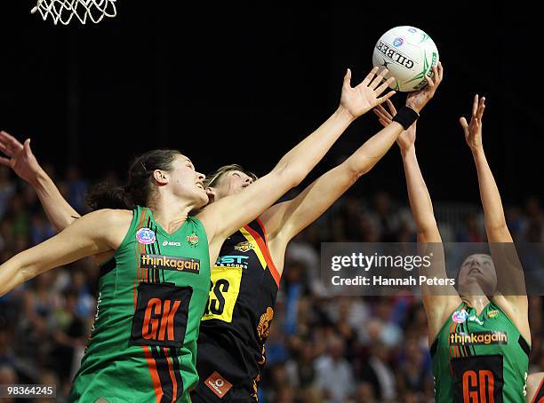 Irene van Dyk of the Magic contests with Susan Fuhrmann and Johannah Curran of the Fever for the ball during the round four ANZ Championship match...