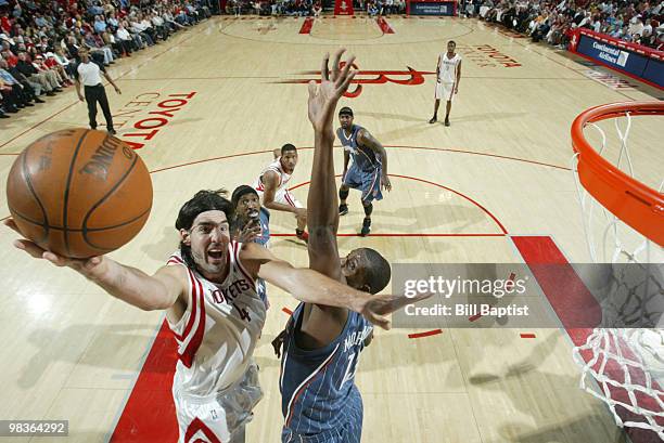 Luis Scola of the Houston Rockets shoots the ball against the Charlotte Bobcats on April 9, 2010 at the Toyota Center in Houston, Texas. NOTE TO...