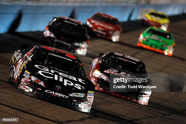 Jason Leffler, driver of the Great Clips Toyota, leads a pack of cars during the NASCAR Nationwide Series Bashas' Supermarkets 200 at Phoenix...