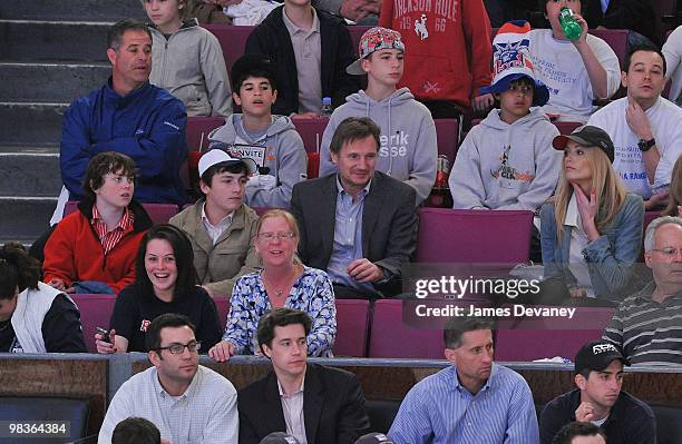 Daniel Neeson, Michael Neeson, Liam Neeson and Jennifer Ohlsson attend a game between the Philadelphia Flyers and the New York Rangers at Madison...