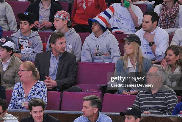 Liam Neeson and Jennifer Ohlsson attend a game between the Philadelphia Flyers and the New York Rangers at Madison Square Garden on April 9, 2010 in...