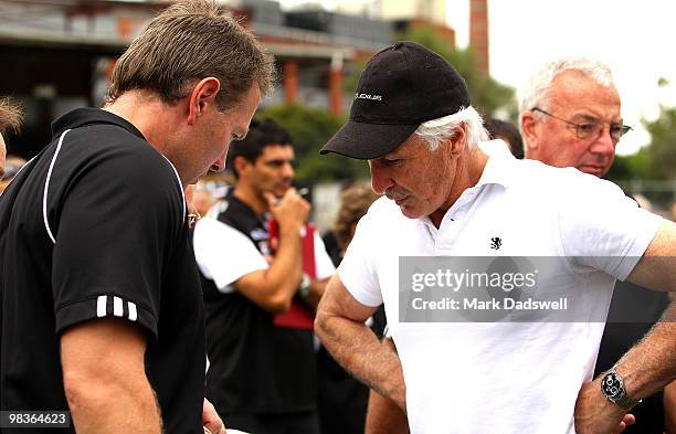 Collingwood coach Michael Malthouse speaks with the Collingwood VFL coach Gavin Brown during the round one VFL match between Collingwood and...