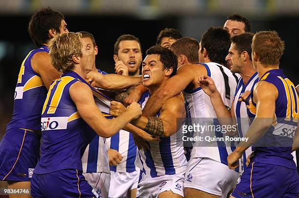 Adam Selwood of the Eagles and Aaron Edwards of the Kangaroos argue during the round three AFL match between the North Melbourne Kangaroos and the...