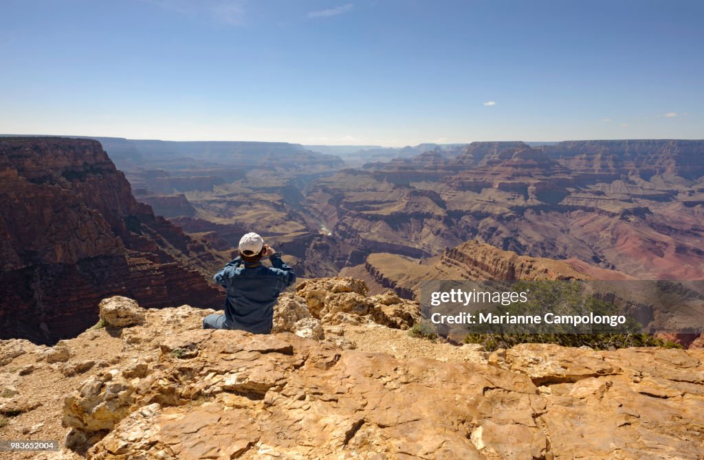 Man at the edge of Grand Canyon