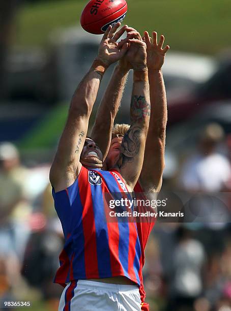 Michael Coad of the Gold Coast and Dean Galea of Port Melbourne compete for the ball during the round one VFL match between the Gold Coast Football...