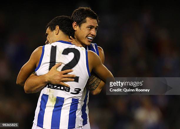 Lindsay Thomas and Aaron Edwards of the Kangaroos celebrate a goal during the round three AFL match between the North Melbourne Kangaroos and the...