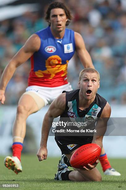 Kane Cornes of the Power passes during the round three AFL match between Port Adelaide Power and Brisbane Lions at AAMI Stadium on April 10, 2010 in...