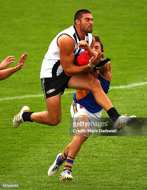 Chris Dawes of the Magpies marks on his chest during the round one VFL match between Collingwood and Williamstown at Victoria Park on April 10, 2010...