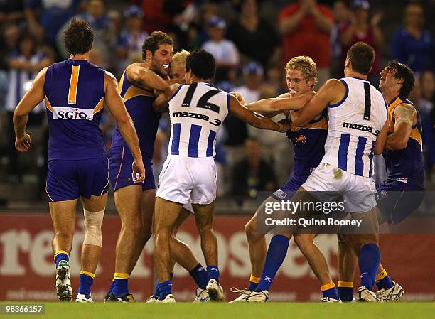 Players wrestle during the round three AFL match between the North Melbourne Kangaroos and the West Coast Eagles at Etihad Stadium on April 10, 2010...