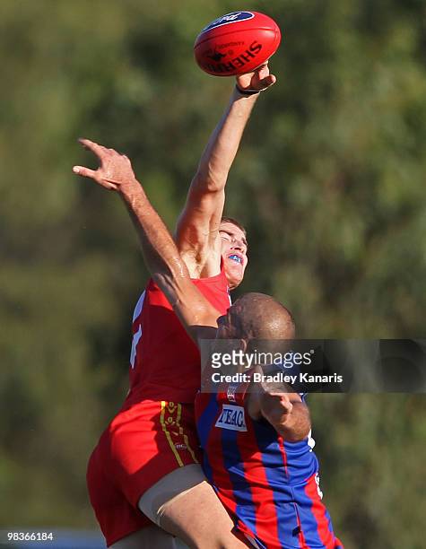 Zac Smith of the Gold Coast gets above Stephen Brewer of Port Melbourne during the round one VFL match between the Gold Coast Football Club and Port...