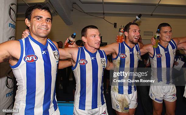 Lindsay Thomas, Brent Harvey, Ben Speight and Scott Thompson of the Kangaroos sing the song in the rooms after winning the round three AFL match...