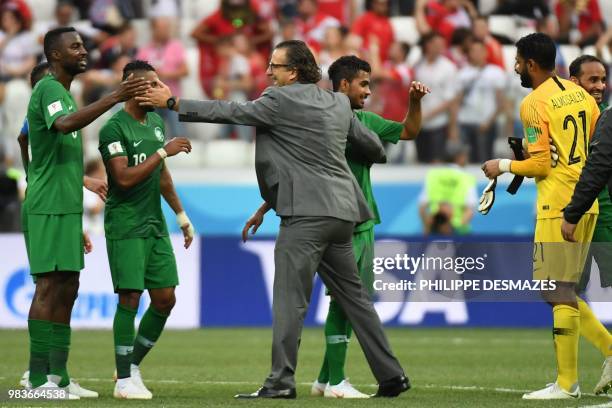 Saudi Arabia's Argentine-born Spanish coach Juan Antonio Pizzi congratulates his players after they won the Russia 2018 World Cup Group A football...