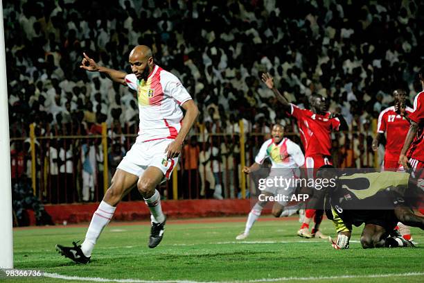 Sudan's goalkeeper Mustafa Hafez tries to stop an unidentifed Mali player from scoring during their 2010 World Cup third round group D qualifying...