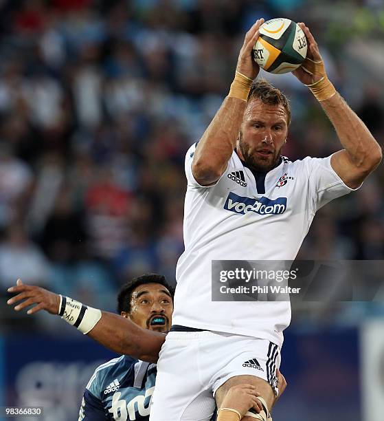 Andries Bekker of the Stormers takes the ball in the lineout above Jerome Kaino of the Blues during the round nine Super 14 match between the Blues...