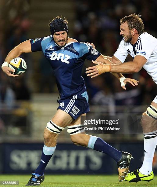 Anthony Boric of the Blues is tackled by Andries Bekker of the Stormers during the round nine Super 14 match between the Blues and the Stormers at...