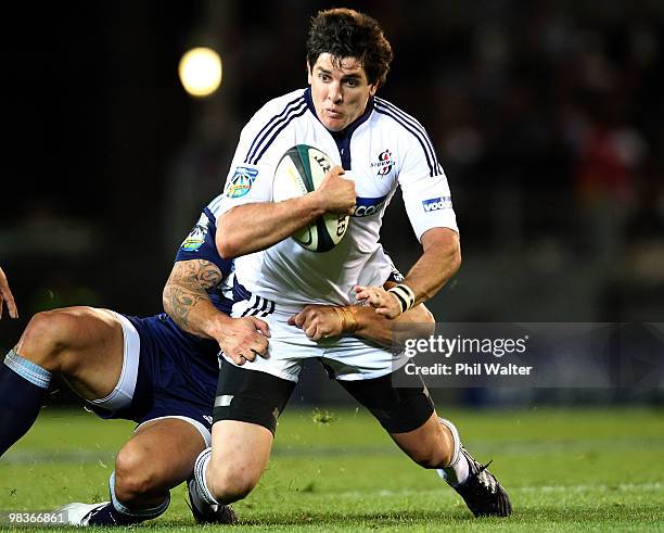 Jaque Fourie of the Stomers is tackled by Luke McAlister of the Blues during the round nine Super 14 match between the Blues and the Stormers at Eden...