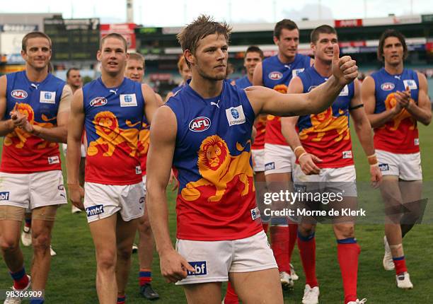 Justin Sherman of the Lions leads the team off after Lions won the game after the round three AFL match between Port Adelaide Power and Brisbane...
