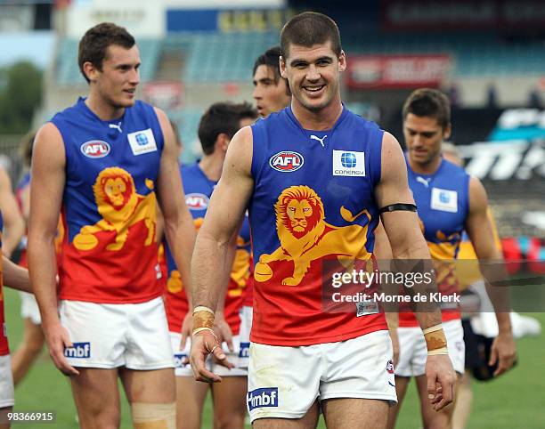 Jonathan Brown of the Lions lead the Lions off the field after winning the round three AFL match between Port Adelaide Power and Brisbane Lions at...