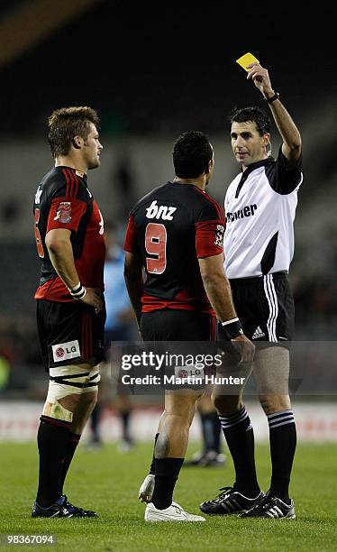 Referee Graig Joubeert yellow cards Kahn Fotuali'i of the Crusaders as Richie McCaw looks on during the round nine Super 14 match between the...