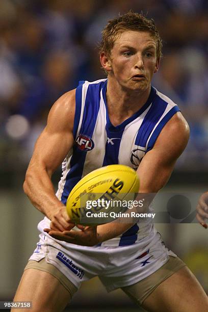 Jack Ziebell of the Kangaroos handballs during the round three AFL match between the North Melbourne Kangaroos and the West Coast Eagles at Etihad...