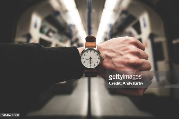 time travel - auf die uhr sehen stock-fotos und bilder