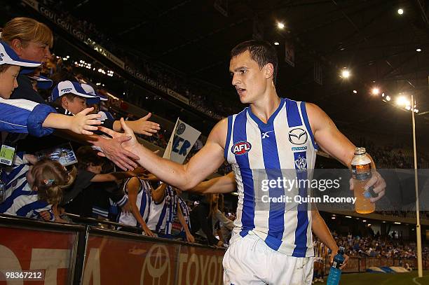 Scott Thompson of the Kangaroos high fives the crowd after the kangaroos won the round three AFL match between the North Melbourne Kangaroos and the...