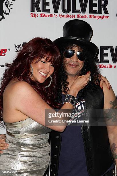 Guitarist Slash and Perla Ferrar arrive at the 2nd Annual Revolver Golden Gods Awards at Club Nokia on April 8, 2010 in Los Angeles, California.