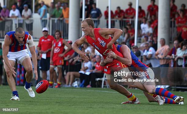 Nathan Ablett of the Gold Coast is challenged by the Port Melbourne defence during the round one VFL match between the Gold Coast Football Club and...