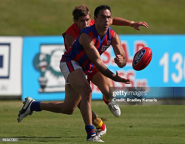 Cory McGrath of Port Melbourne handballs during the round one VFL match between the Gold Coast Football Club and Port Melbourne at Southport Sharks...