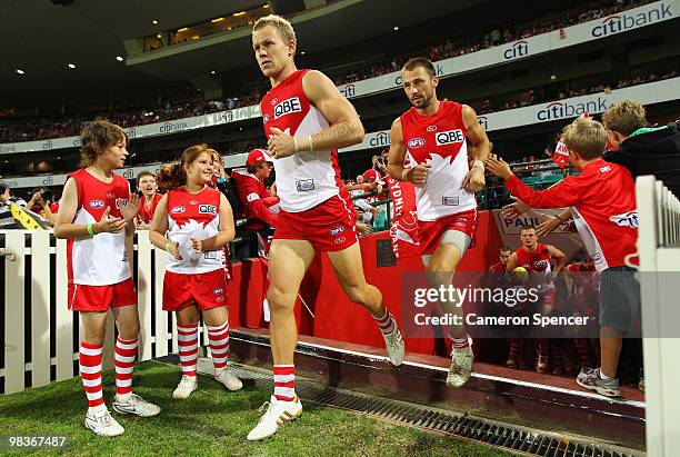 Ryan O'Keefe and Nick Malceski of the Swans run up the players tunnel onto the field during the round three AFL match between the Sydney Swans and...