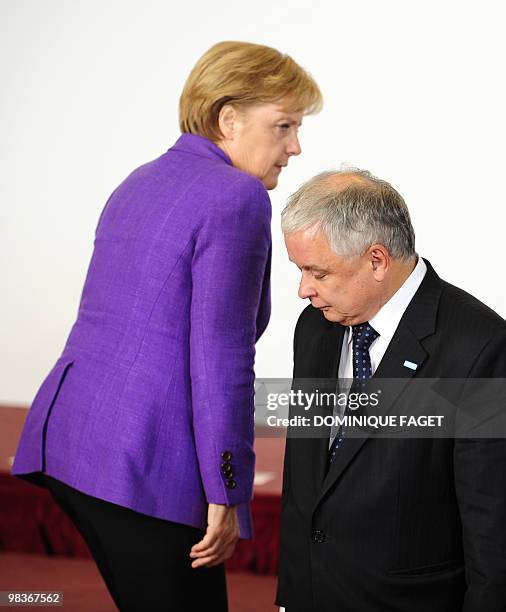 German Chancellor Angela Merkel and Polish President Lech Kaczynski are pictured during a family photo of the EU summit at the European Council...