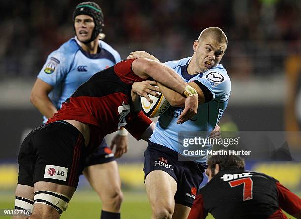 Drew Mitchell of the Waratahs is tackled during the round nine Super 14 match between the Crusaders and the Waratahs AMI Stadium on April 10, 2010 in...