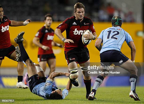 Richie McCaw of the Crusaders confronts Berrick Barnes of the Waratahs during the round nine Super 14 match between the Crusaders and the Waratahs...