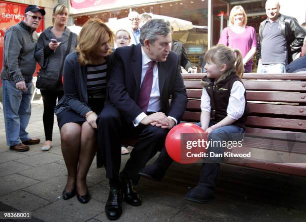 British Prime Minister Gordon Brown and wife Sarah Brown speak with Amy Leigh, aged 8 as they meet with locals on Kirkcaldy High Street as part of...