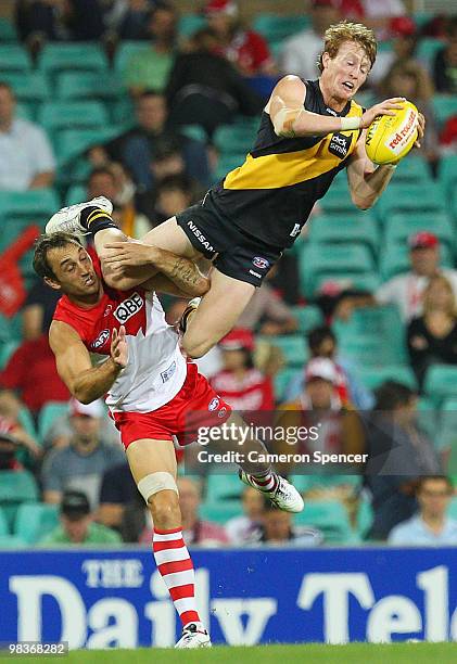 Daniel Connors of the Tigers attempts to mark over Daniel Bradshaw of the Swans during the round three AFL match between the Sydney Swans and the...