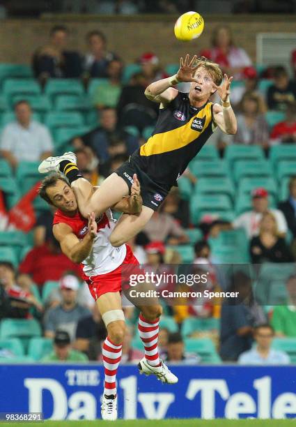 Daniel Connors of the Tigers attempts to mark over Daniel Bradshaw of the Swans during the round three AFL match between the Sydney Swans and the...