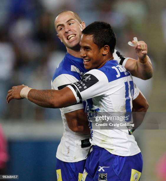 Ben Barba of the Bulldogs celebrates scoring a try with team mate Luke Patten during the round five NRL match between the Canterbury Bulldogs and the...