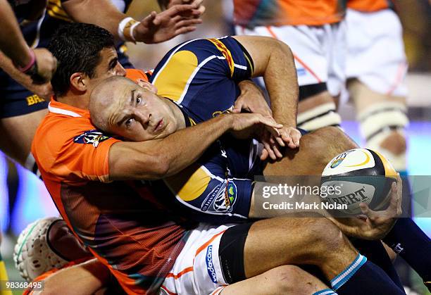 Stephen Moore of the Brumbies looks to offload during the round nine Super 14 match between the Brumbies and the Cheetahs at Canberra Stadium on...