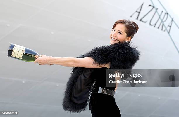 Ballerina Darcey Bussell swings a bottle of champagne as she is named as 'Godmother' to P&O's latest Cruise Ship Azura at Ocean Docks on April 10,...