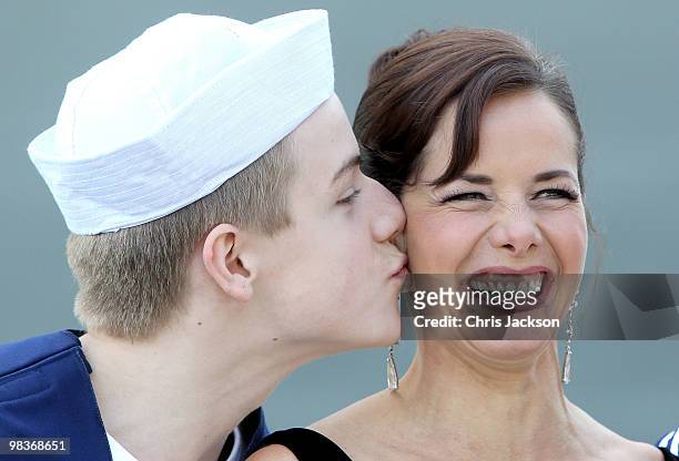 Ballerina Darcey Bussell is kissed by a member of the Royal Ballet School dressed as sailors as she is named as 'Godmother' to P&O's latest Cruise...