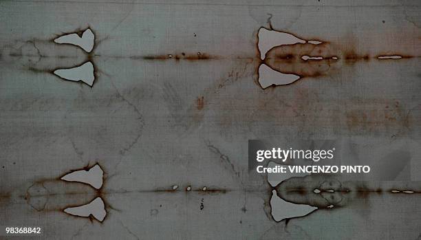 The Shroud of Turin, showing alleged images of the face and hands of Jesus Christ is displayed on public for the first time in ten years on April 10,...