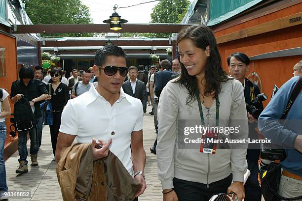 Former tennis pro Ana Ivanovic with Chinese actor Aaron Kwok poses in the 'Village', the VIP area of the French Open at Roland Garros arena in Paris,...