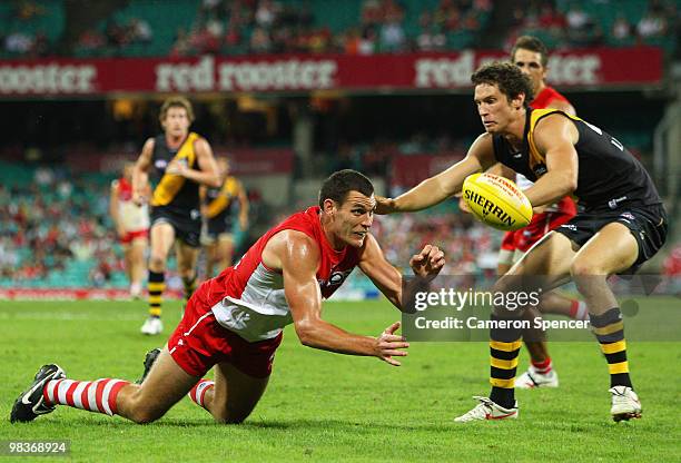 Mark Seaby of the Swans hand-passes during the round three AFL match between the Sydney Swans and the Richmond Tigers at Sydney Cricket Ground on...
