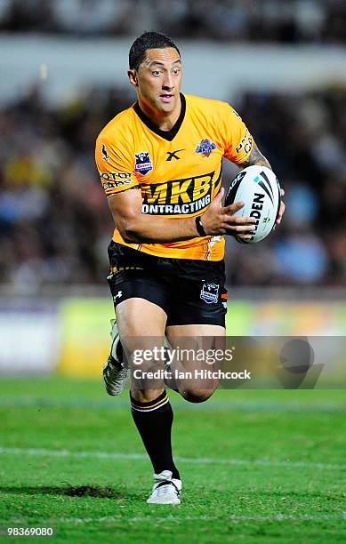 Benji Marshall of the Tigers runs the ball during the round five NRL match between the North Queensland Cowboys and the West Tigers at Dairy Farmers...