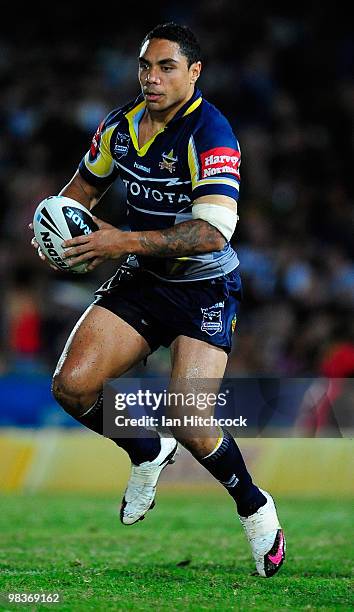 Willie Tonga of the Cowboys runs the ball during the round five NRL match between the North Queensland Cowboys and the West Tigers at Dairy Farmers...