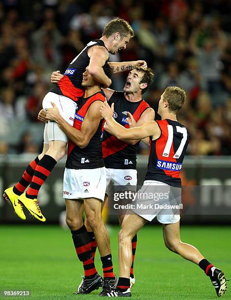 Patrick Ryder of the Bombers celebrates a goal with Kyle Reimers during the round three AFL match between the Carlton Blues and the Essendon Bombers...