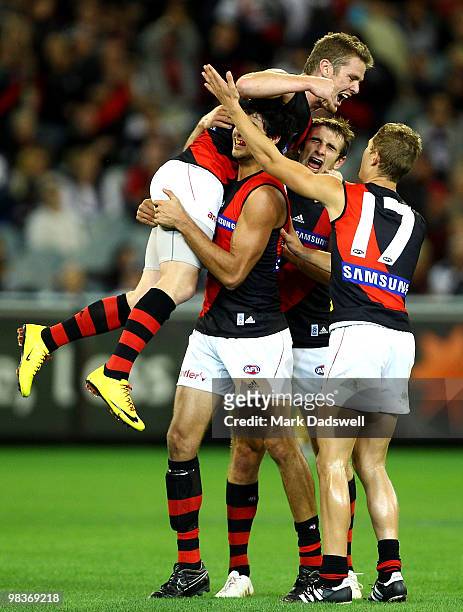 Patrick Ryder of the Bombers celebrates a goal with Kyle Reimers during the round three AFL match between the Carlton Blues and the Essendon Bombers...